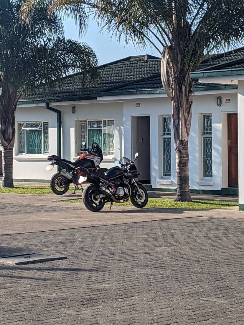 Guest rooms and parking at Munda Hotel